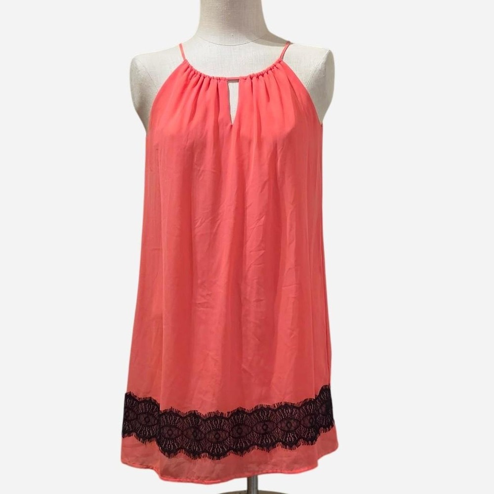 Sweet Storm women's sleeveless tunic top in a bright coral pink